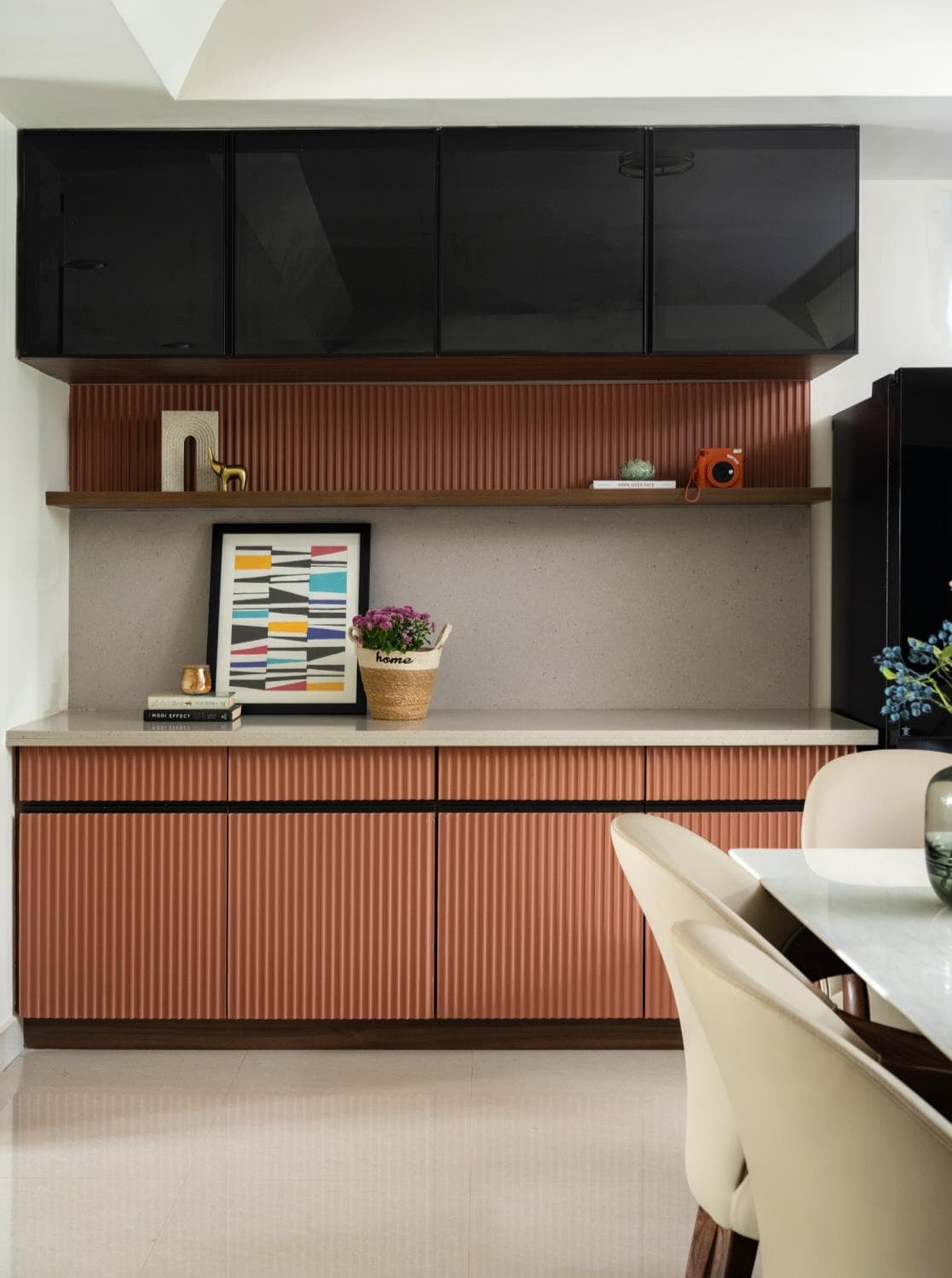 Tall crockery unit with glass-front shelving and integrated display lighting